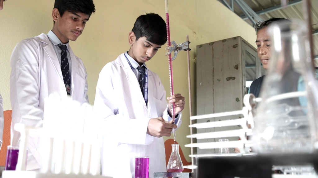 Students performing experiment in Science lab